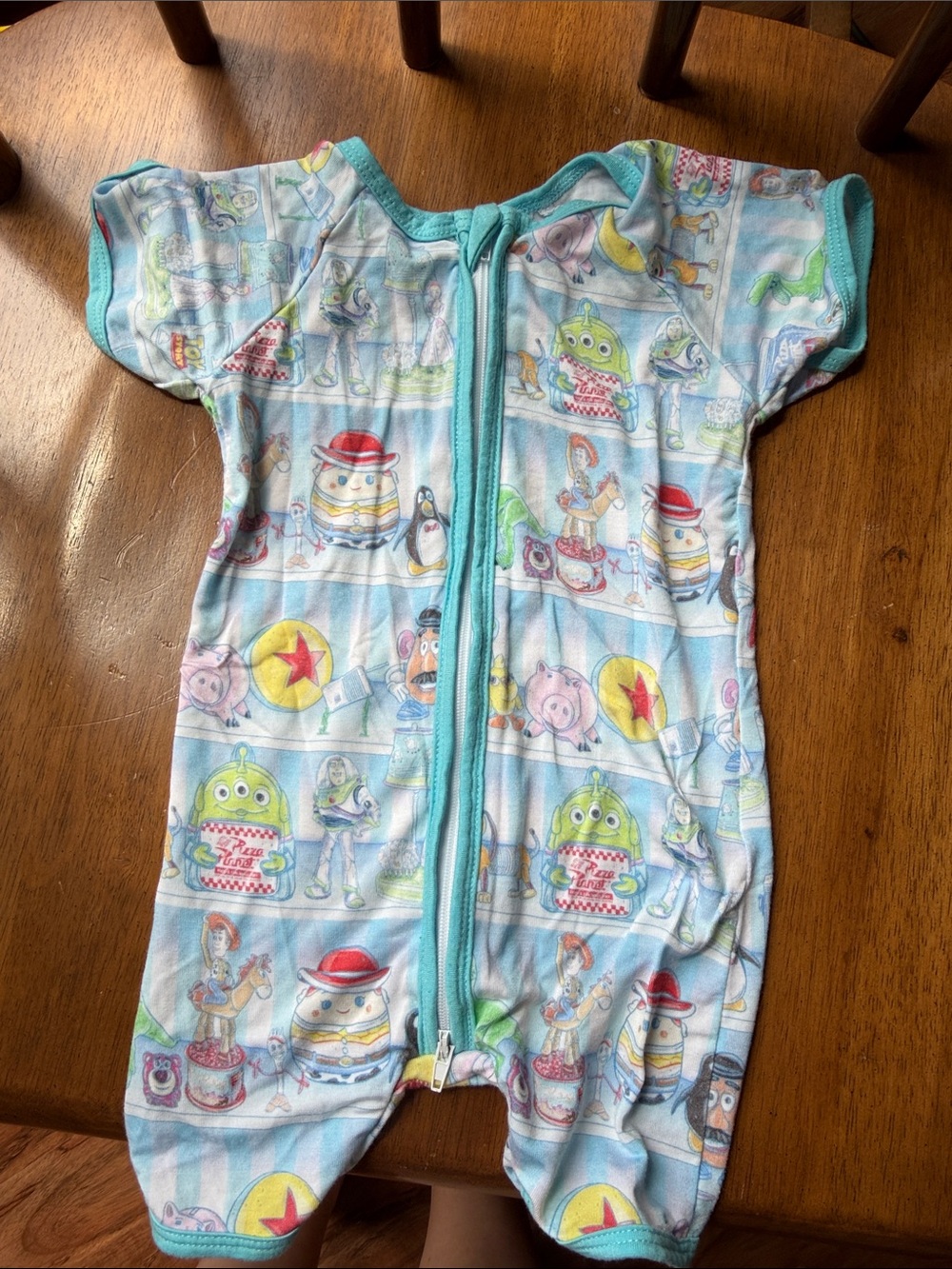 BAMBOO Light Blue Multi-Color Toy Story Print Baby One-Piece